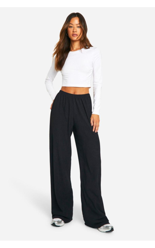 Високі широкі брюки з м'ятками