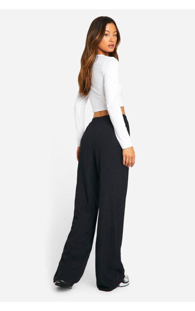 Високі широкі брюки з м'ятками