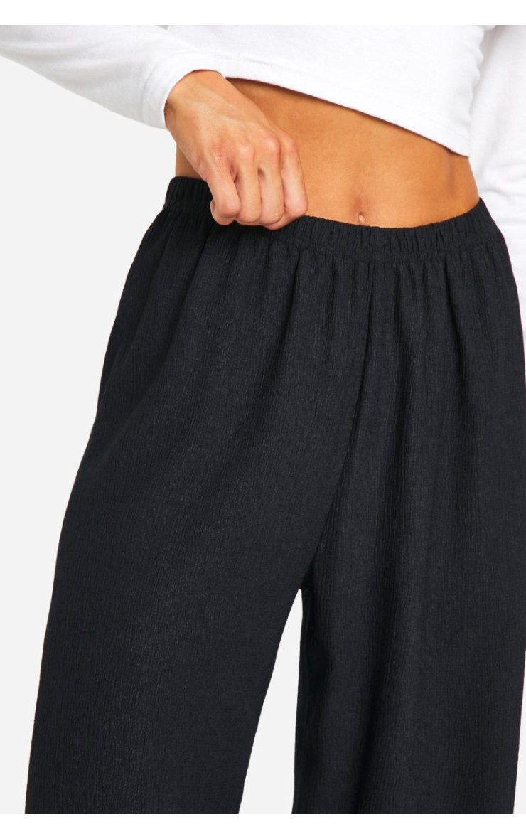 Високі широкі брюки з м'ятками