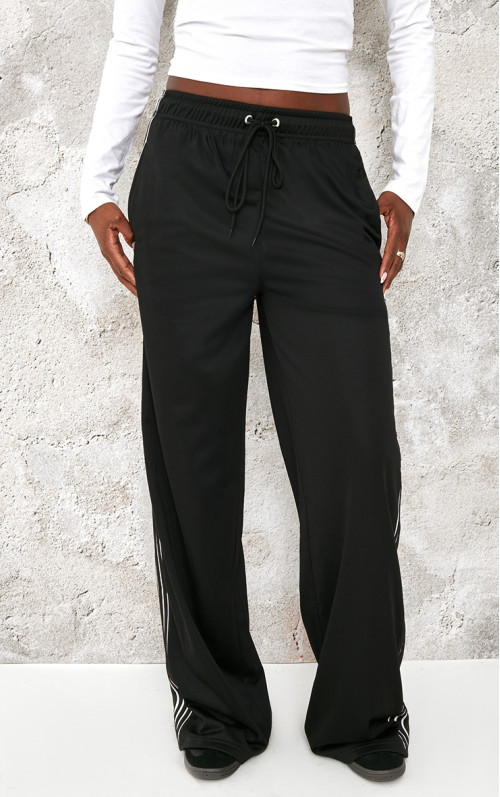 Високі чорні трикотичні смужки широкі пробіжки ноги