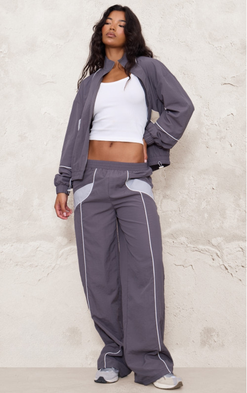 Широкі джоггери на блискавці темно-коричневого кольору з контрастною палітуркою