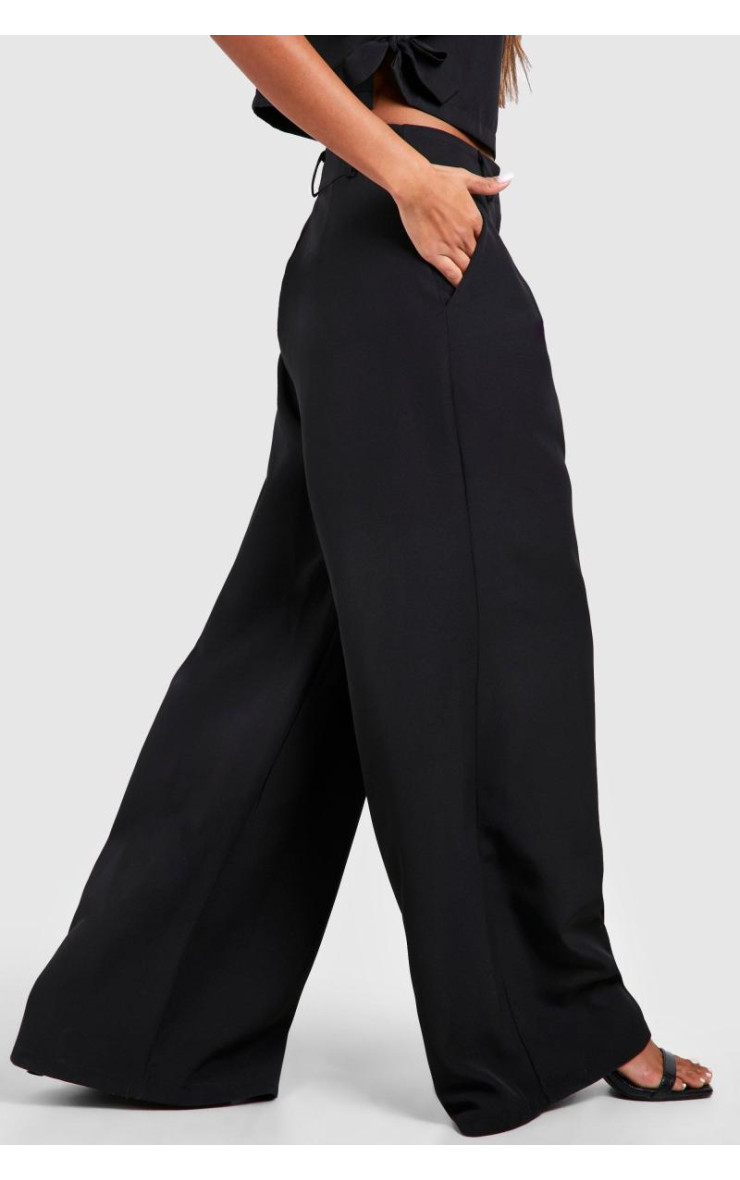 Широкі плісировані штани з високою талією